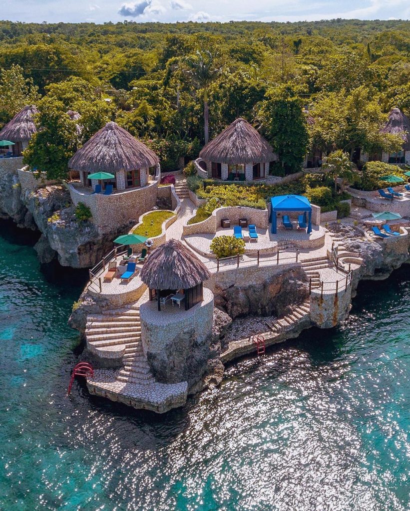 Huts at the Rockhouse Hotel surrounded by the ocean in Jamaica.