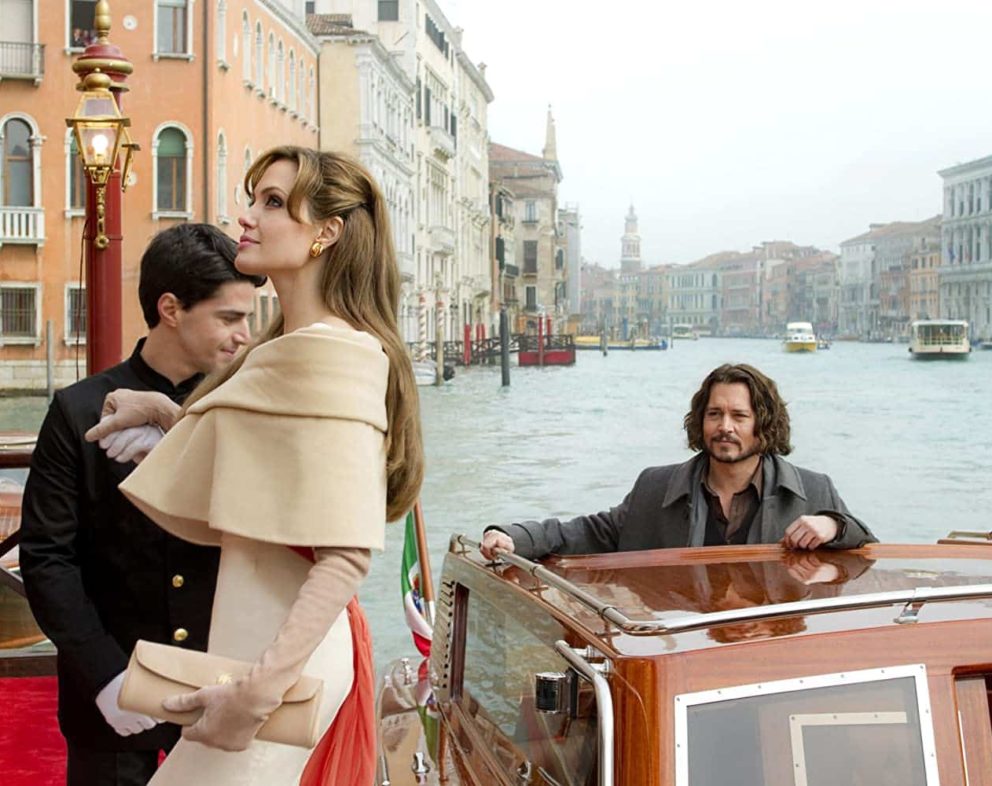 Scene from the movie The Tourist. Johnny Depp is on a boat in Italy with Angelina Jolie stepping onto a dock.