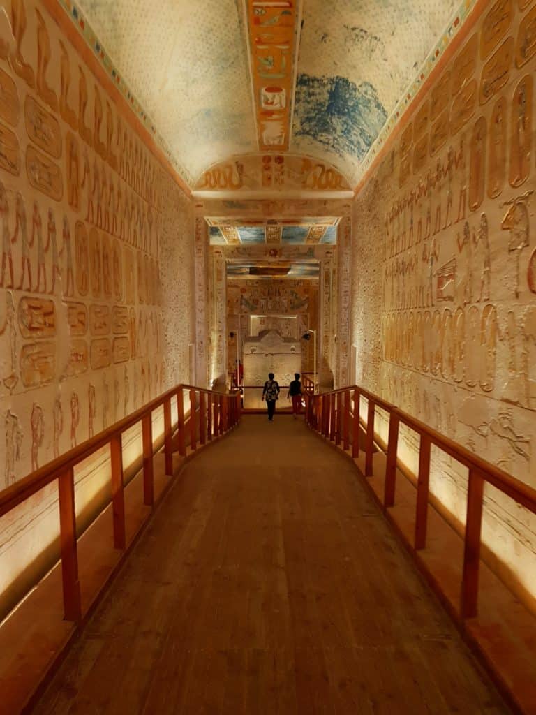 Hieroglyphics inside a large, narrow room in Egypt.