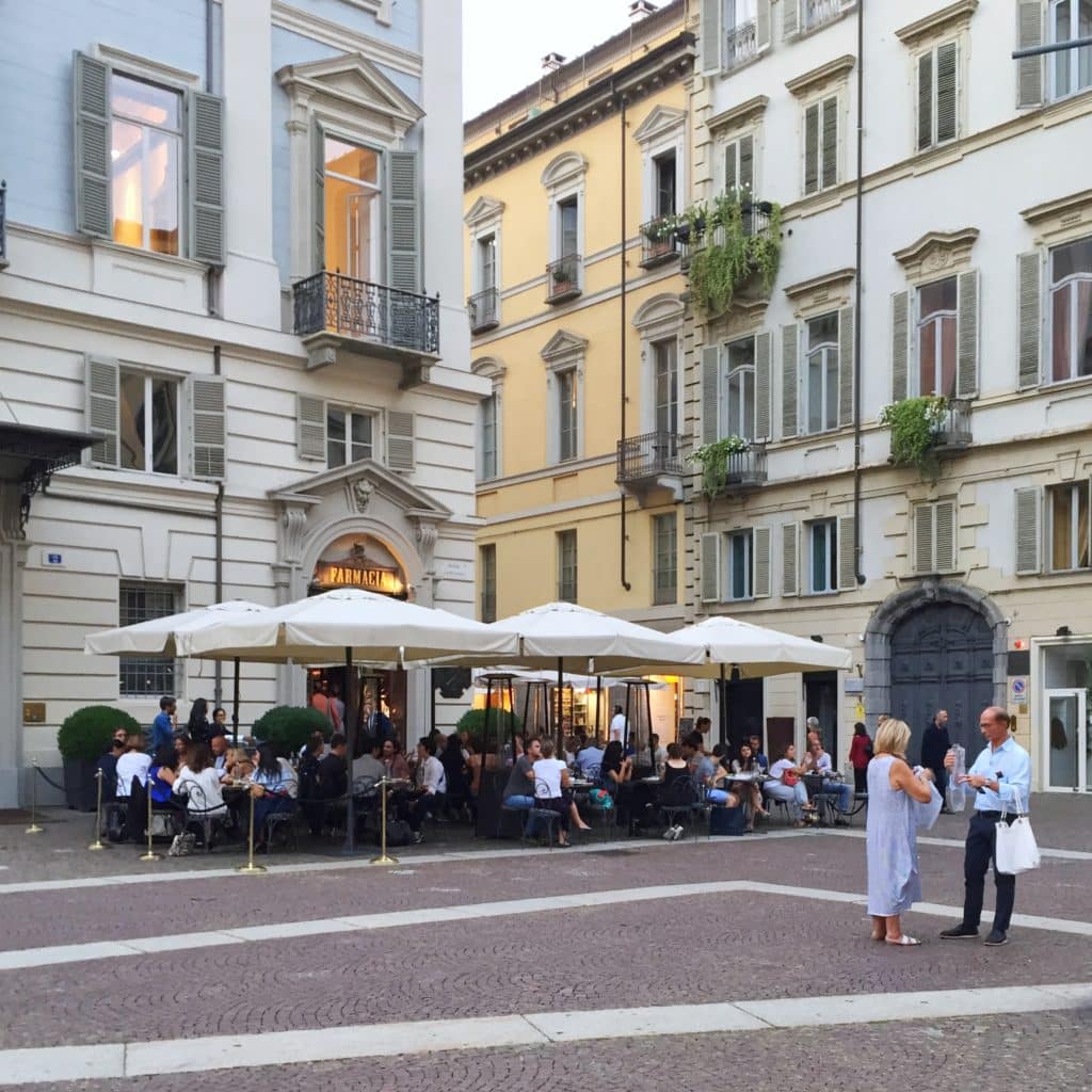 Outdoor dining area on a street in Italy.